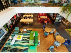an overhead view of a restaurant with tables and chairs at citizenM Kuala Lumpur Bukit Bintang in Kuala Lumpur