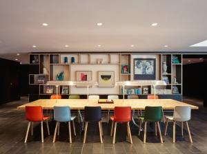 a conference room with a table and chairs at citizenM Kuala Lumpur Bukit Bintang in Kuala Lumpur