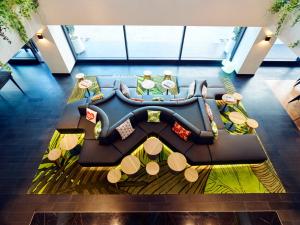 a living room with a couch and a table at citizenM Kuala Lumpur Bukit Bintang in Kuala Lumpur