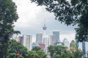 a city skyline with the television tower in the distance at citizenM Kuala Lumpur Bukit Bintang in Kuala Lumpur