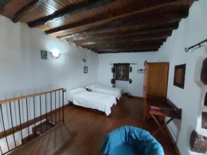 Postel nebo postele na pokoji v ubytování Casa los Abuelos