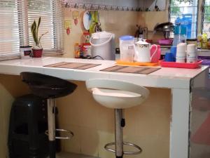 Kuchyň nebo kuchyňský kout v ubytování D'Hartamas Guesthouse