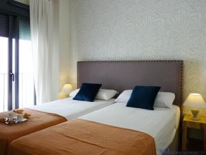 Posteľ alebo postele v izbe v ubytovaní ALAMEDA SQUARE APARTMENT