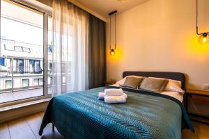 Posteľ alebo postele v izbe v ubytovaní VIP Apartamenty Butikowa