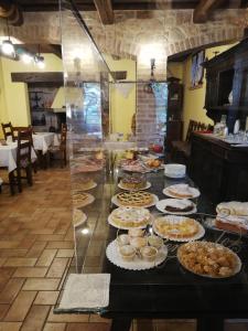 a buffet with many plates of food on a table at Il renaiolo in Spello
