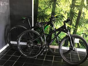 a black bike parked next to a wall at Blouberg Studio Apartment in Bloubergstrand