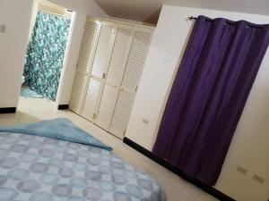 A bed or beds in a room at Montego Bay Home Close to Resort Area and Airport