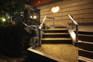 a set of stairs with a heart on the wall at Dogo Kan in Matsuyama