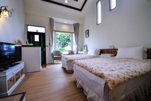 מיטה או מיטות בחדר ב-Starhome Cottage