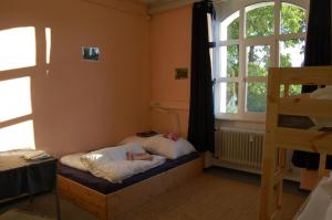 Postel nebo postele na pokoji v ubytování Oberzent-Hostelstyle nur für aktive Touristen