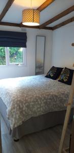 a bedroom with a large bed in a room at 8F Lakeside Lodge Caer Beris Builth Wells in Builth Wells
