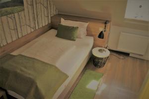 Postel nebo postele na pokoji v ubytování Hotel Eifelbräu