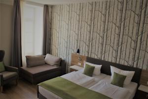 Postel nebo postele na pokoji v ubytování Hotel Eifelbräu