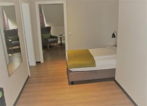 Postel nebo postele na pokoji v ubytování Hotel Eifelbräu
