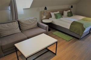 Postel nebo postele na pokoji v ubytování Hotel Eifelbräu