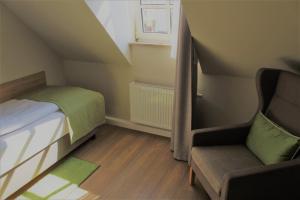 Postel nebo postele na pokoji v ubytování Hotel Eifelbräu