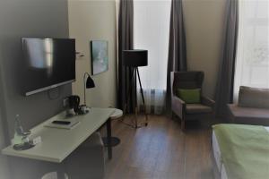 TV a/nebo společenská místnost v ubytování Hotel Eifelbräu