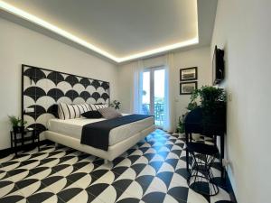 Postel nebo postele na pokoji v ubytování NeroBianco B&B Sorrento
