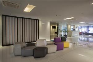 Uma área de estar em Hotel WZ Jardins