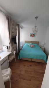 Postel nebo postele na pokoji v ubytování Rilati palace Dubrovnik 3