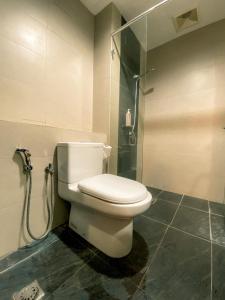 a bathroom with a toilet and a shower at Maison life 小居屋 The Loft Imago in Kota Kinabalu