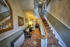 a staircase in a home with a stair case at West End Guest House in Richmond