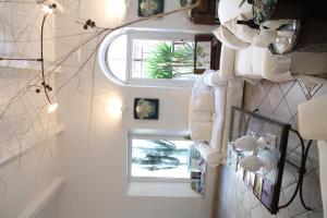 a staircase with two windows in a room at B&B Casa Ruffino in Balestrate