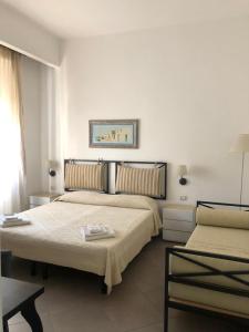 En eller flere senge i et værelse på B&B Piazza Dante Nuoro