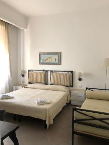 Postel nebo postele na pokoji v ubytování B&B Piazza Dante Nuoro