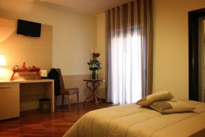 Postel nebo postele na pokoji v ubytování Hotel Ottagono