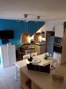 a kitchen with a table and chairs in a room at Casa Paola e Guido in Posada