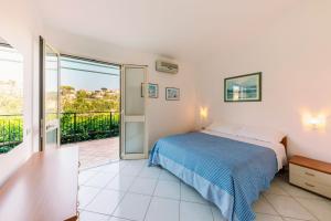 Tempat tidur dalam kamar di Villa San Lorenzo