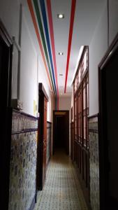 a hallway with a rainbow painted on the ceiling at The Cathedral Hostel in Murcia