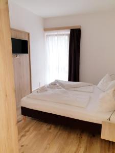 A bed or beds in a room at CityApartment MONIKA