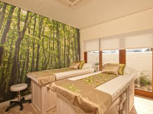 Postel nebo postele na pokoji v ubytování Turbine Hotel & Spa
