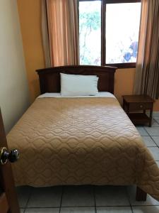 Postel nebo postele na pokoji v ubytování Hosteria Shell