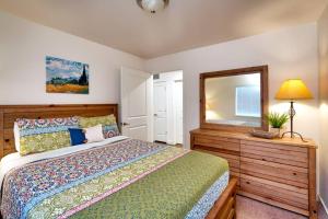 a bedroom with a bed and a mirror at 5I Cozy Family Friendly Moab Condo in Moab