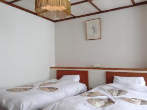 Postel nebo postele na pokoji v ubytování Resort Inn Chitose