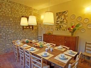 a dining room with a large wooden table and chairs at Holiday Home Casa delle Fiabe by Interhome in San Casciano in Val di Pesa