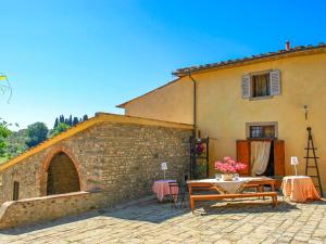 a patio in front of a building with a table at Holiday Home Casa delle Fiabe by Interhome in San Casciano in Val di Pesa