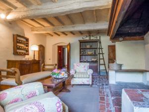 a living room with a couch and a table and chairs at Holiday Home Casa delle Fiabe by Interhome in San Casciano in Val di Pesa
