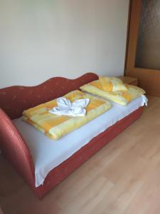 Postel nebo postele na pokoji v ubytování Bianka Apartmanház