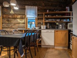 a dining room with a table and chairs in a kitchen at Holiday Home Ylläsparit as- 2 by Interhome in Ylläsjärvi