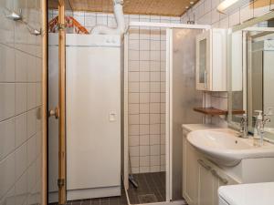 a bathroom with a white refrigerator and a sink at Holiday Home Ylläs chalets a307 by Interhome in Ylläs