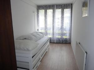 Apartment Neuschwändi 5 by Interhome tesisinde bir odada yatak veya yataklar