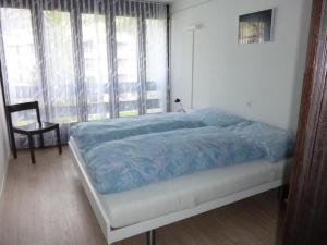 Apartment Neuschwändi 5 by Interhome tesisinde bir odada yatak veya yataklar