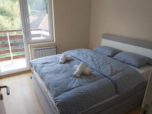 Voodi või voodid majutusasutuse Apartmani Sigma toas