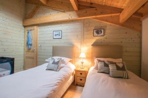Ένα ή περισσότερα κρεβάτια σε δωμάτιο στο Chalet Domino