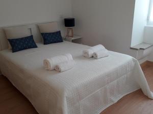 Ένα ή περισσότερα κρεβάτια σε δωμάτιο στο As Casinhas dos avós by Quinta do Paço +8 φωτογραφίες