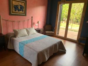 A bed or beds in a room at A PORTELA - Pereiro de Aguiar